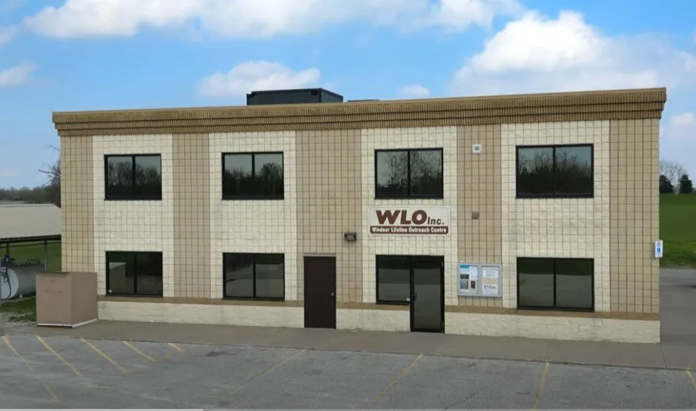 The Windsor Lifeline Outreach building, a two-storey beige brick office with the WLO sign above the entrance.