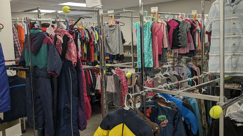Racks of donated coats and clothing in a partner organization's outreach centre.